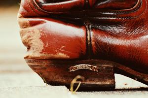 Use a pencil eraser to remove small scuffs on cowboy boots